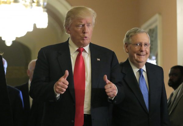 US President-elect Donald Trump gives a thumbs up sign as he walks with Senate Majority Leader Mitch McConnell on Capitol Hill in Washington, US, 10 November 2016. (Photo: Reuters/Joshua Roberts).