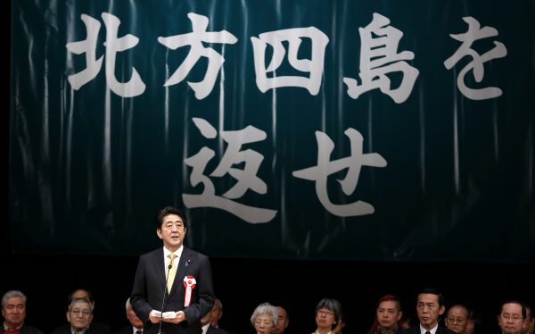 Japan's Prime Minister Shinzo Abe speaks during a Northern Territories Day rally to call on Russia to return a group of islands in Tokyo 7 February 2015 (Photo: Reuters/Yuya Shino)