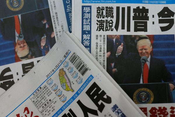 Copies of Taiwanese daily newspaper Liberty Times, with its front page on the inauguration of US President Donald Trump, are seen a printing house in Taipei, Taiwan, 21 January 2017 (Photo: Reuters/Tyrone Siu)