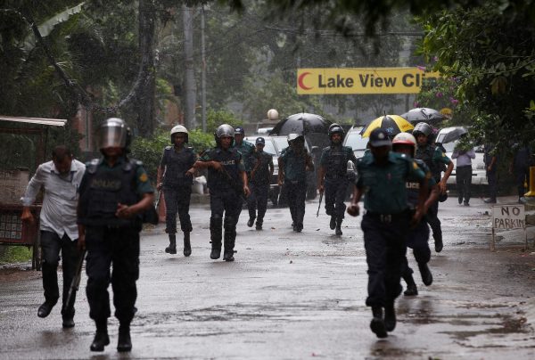 Policemen patrol on the road leading to the Holey Artisan Bakery and the O'Kitchen Restaurant after gunmen attacked, in Dhaka, Bangladesh, 3 July, 2016. (Photo: Reuters/Adnan Abidi).