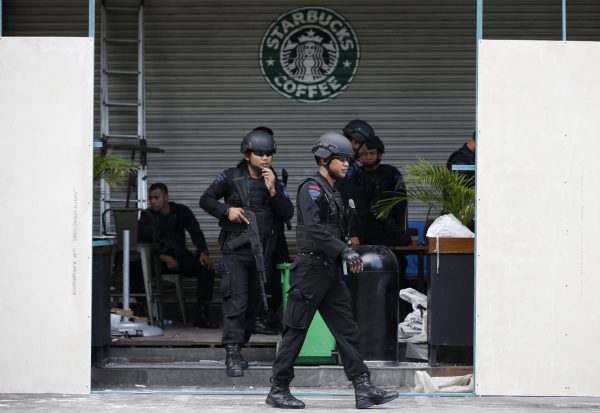 Indonesian police stand guard at the site of a militant attack in central Jakarta, Indonesia, 16 January 2016 (Photo: Reuters/Darren Whiteside)