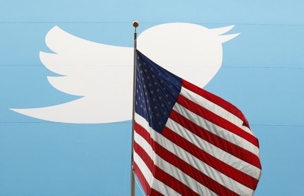 The Twitter logo is shown with the US flag on the floor of the New York Stock Exchange. (Photo: Reuters/Lucas Jackson).
