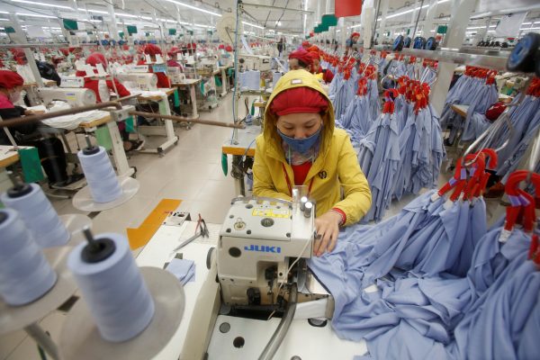 Women work at a garment factory in Hai Duong province, outside Hanoi, Vietnam, 28 December 2016. (Photo: Reuters/Kham).