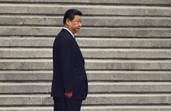 China's President Xi Jinping waits for his Palestinian counterpart Mahmoud Abbas before a welcoming ceremony outside the Great Hall of the People in Beijing, China, 6 May 6 2013. (Photo: Reuters/Petar Kujundzic).