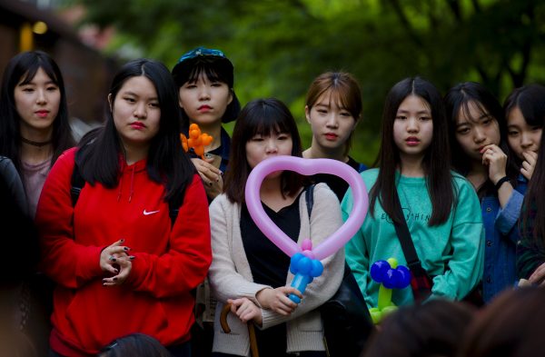 The young and well educated are comfortable with living around foreigners and accept that non-ethnic South Koreans can qualify for citizenship. (Photo: Reuters/Thomas Peter).