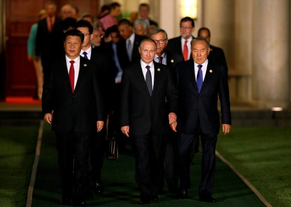 China's President Xi Jinping, Russian President Vladimir Putin and Kazakhstan's President Nursultan Nazarbayev arrive for a family photo during the G20 Summit in Hangzhou, Zhejiang province, China, 4 September, 2016. (Photo: Reuters/Damir Sagolj).
