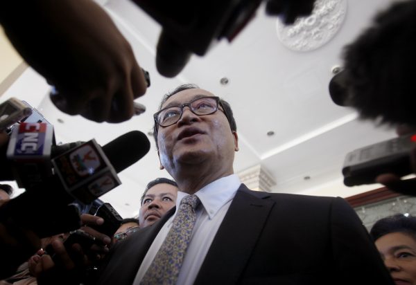 Sam Rainsy, former President of the Cambodia National Rescue Party (CNRP), speaks to media after a meeting at the National Assembly in central Phnom Penh, Cambodia, 8 August 2014. (Photo: Reuters/Samrang Pring).
