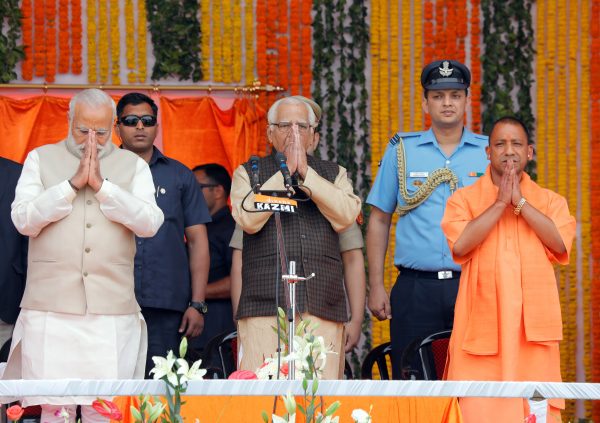 Prime Minister Narendra Modi, Uttar Pradesh governor Ram Naik and new Chief Minister of Uttar Pradesh Yogi Adityanath greet a gathering before a swearing-in ceremony in Lucknow, India (Photo: Reuters/Pawan Kumar).