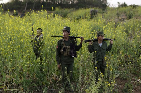 Rebel soldiers of Myanmar National Democratic Alliance Army (MNDAA) patrol near a military base in Kokang region, Myanmar, 10 March 2015. (Photo: Reuters/Stringer).