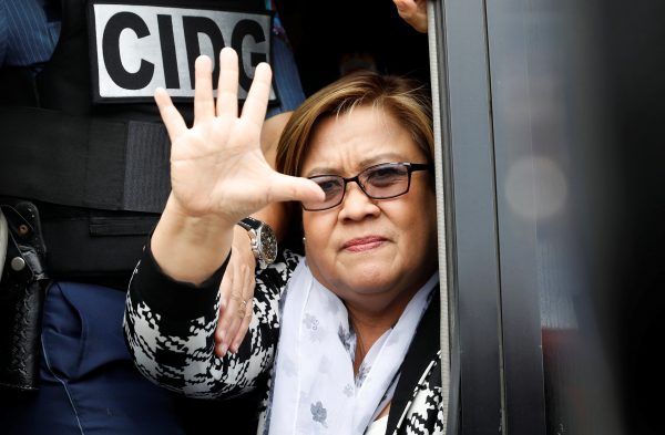 Philippine Senator Leila De Lima waves from a police van after appearing at a Muntinlupa court on drug charges in Muntinlupa, Metro Manila, Philippines, 24 February 2017. (Photo: Reuters/Erik De Castro).