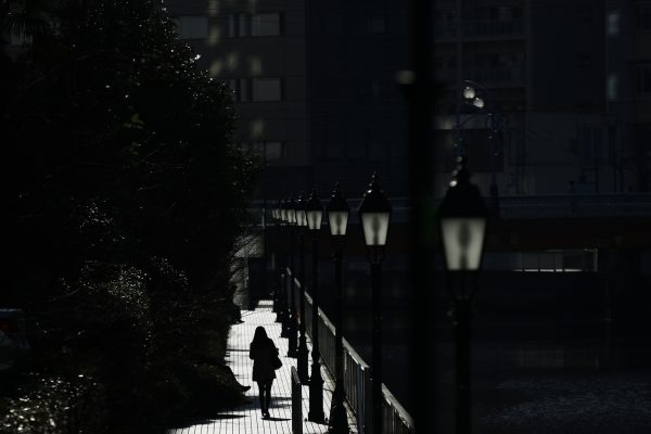 A woman walks along a canal on a sunny day in Tokyo, Japan, 3 March 2016. (Photo: Reuters/Thomas Peter).