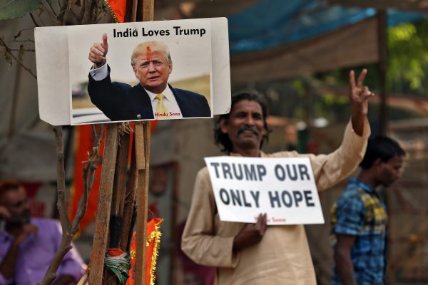 A member of Hindu Sena, a right-wing Hindu group, celebrate Republican presidential nominee Donald Trump's victory in the US elections, in New Delhi, India, 9 November 2016 (Photo: Reuters/Cathal McNaughton).