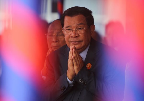 President of the Cambodian People's Party (CPP) and Prime Minister Hun Sen greets during a ceremony at the party headquarters to mark the 38th anniversary of the toppling of Pol Pot's Khmer Rouge regime in Phnom Penh, Cambodia, 7 January 2017. (Photo: Reuters/Samrang Pring).