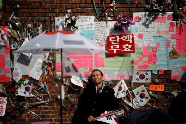 A supporter of South Korea's ousted leader Park Geun-hye reacts after Park (not pictured) left her private house in Seoul, South Korea, 30 March 2017. (Photo: Reuters/Kim Hong-Ji).