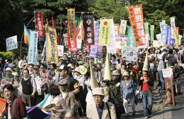 Protesters march at a rally against the revision of Article 9 of the Japanese Constitution in Tokyo (Photo: Reuters/Kim Kyung-Hoon).
