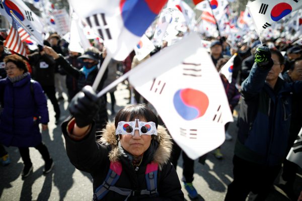 Supporters of South Korean President Park Geun-hye attend a protest before the Constitutional Court ruling on Park's impeachment (Photo: Reuters/Kim Hong-J).