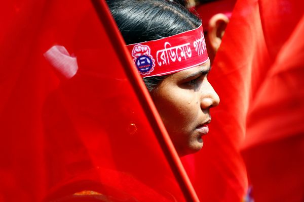 A garments worker looks on as she attends an International Labor Day rally in Dhaka, Bangladesh, 1 May 2017. (Photo: Reuters/Mohammad Ponir Hossain).