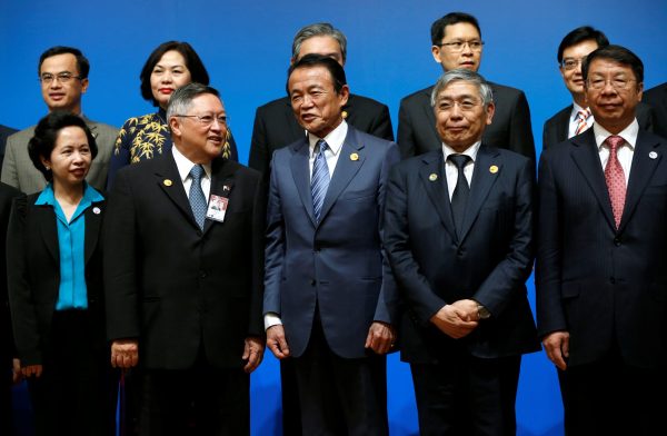 Ministers and central bank governors pose during a photo session at the ASEAN+3 Finance Ministers and Central Bank Governors' Meeting on the sideline of Asian Development Bank’s annual meeting in Yokohama, Tokyo, 5 May, 2017 (Photo: Reuters/Issei Kato).