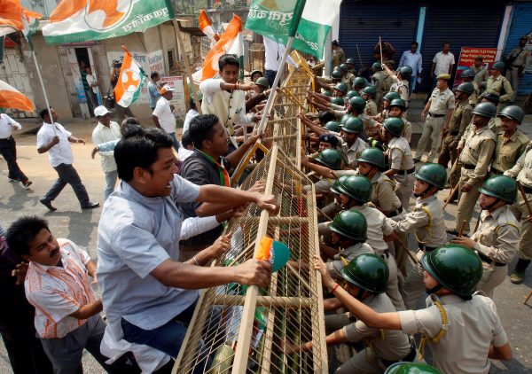 Demonstrators try to cross a police barricade during a protest organised by India's main opposition Congress party against demonetisation, in Agartala, India, 17 February, 2017 (Photo: Reuters/Jayanta Dey).