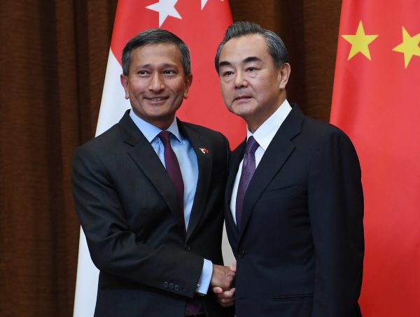 Singapore's Foreign Minister Vivian Balakrishnan (L) shakes hands with Chinese Foreign Minister Wang Yi before a meeting at the Ministry of Foreign Affairs in Beijing, China on June 12, 2017. (Photo: Reuters/Greg Baker).