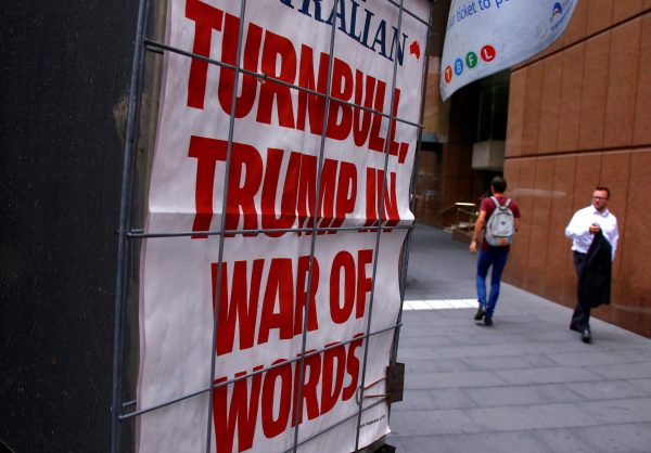 A pedestrian walks past a newspaper headline regarding US President Donald Trump and Australian Prime Minister Malcolm Turnbull, in central Sydney, Australia, 3 February 2017 (Photo: Reuters/David Gray).