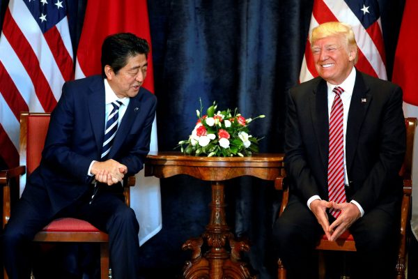 US President Donald Trump (R) and Japan's Prime Minister Shinzo Abe smile during a bilateral meeting at the G7 summit in Taormina, Sicily, Italy, 26 May 2017. (Photo: Reuters/Jonathan Ernst).