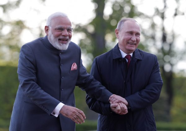 Russian President Vladimir Putin and Indian Prime Minister Narendra Modi react while walking near the Constantine (Konstantinovsky) Palace during their meeting in St. Petersburg, Russia, 1 June 2017 (Photo: Reuters/Mikhail Metzel/TASS).