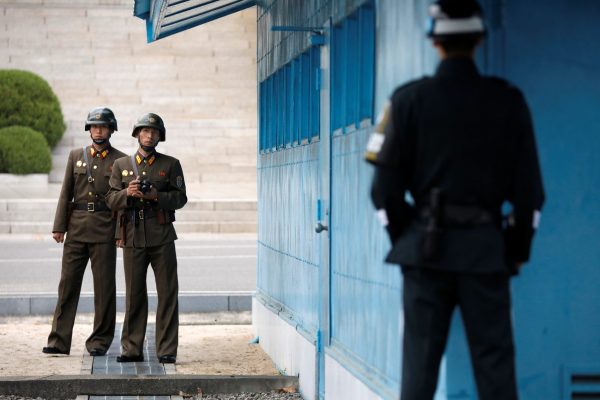 North Korean soldiers keep watch toward the south in Panmunjom, South Korea, 17 April 2017 (Photo: Reuters/Kim Hong-Ji).