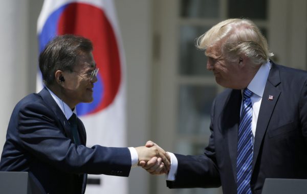 US President Donald Trump (R) greets South Korean President Moon Jae-in prior to delivering a joint statement from the Rose Garden of the White House in Washington, US, 30 June 2017. (Photo: Reuters/Jim Bourg).