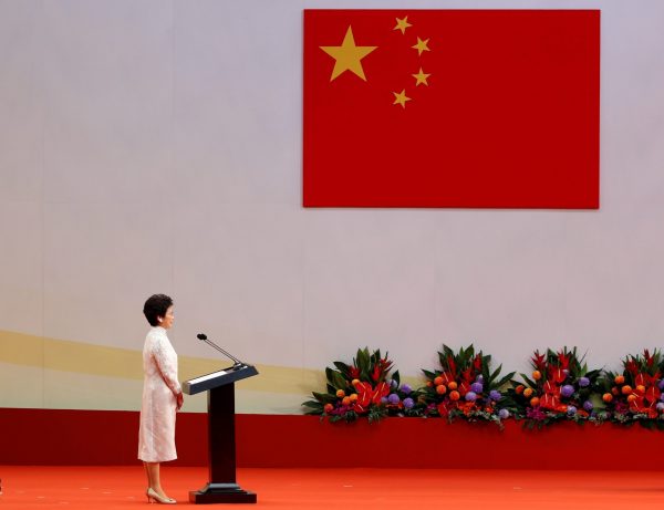 Hong Kong Chief Executive Carrie Lam stands on the podium before taking her oath, during the 20th anniversary of the city's handover from British to Chinese rule, in Hong Kong, China, 1 July 2017. (Photo: Reuters/Bobby Yip).