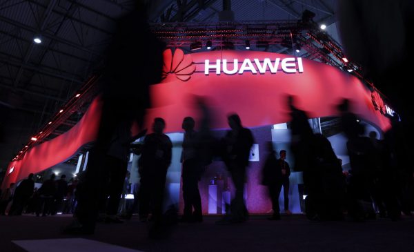 Visitors walk past Huawei's booth during Mobile World Congress in Barcelona, Spain, 27 February 2017. (Photo: Reuters/Eric Gaillard).