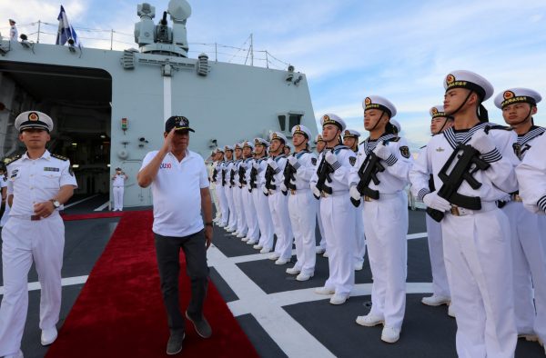 Philippine President Rodrigo Duterte salutes Chinese People's Liberation Army (PLA) navy soldiers during a visit to a Chinese Naval ship in Davao city, Philippines, 1 May 2017. (Photo: China Daily/via Reuters).