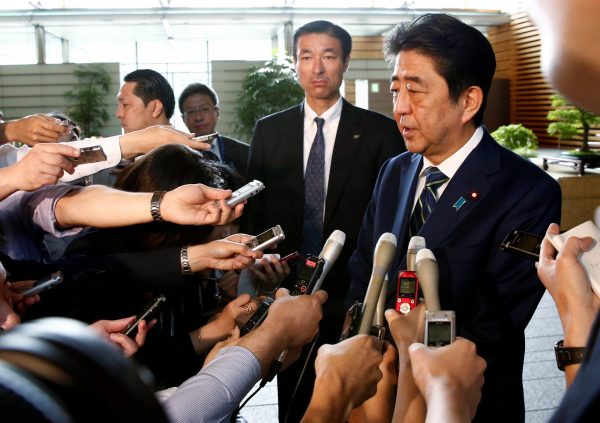 Japan's Prime Minister Shinzo Abe speaks to reporters as he arrives at his office in Tokyo, Japan, 3 July 2017 (Photo: Reuters/Kim Kyung-Hoon).