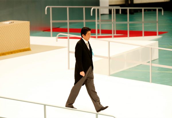 Japan's Prime Minister Shinzo Abe walks toward his seat after bowing to an altar for the war dead during a memorial ceremony marking the 72nd anniversary of Japan's surrender in World War Two, at Budokan Hall in Tokyo, Japan, 15 August 2017. (Photo: Reuters/Kim Kyung-Hoon).