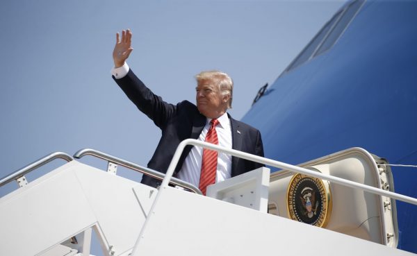 US President Donald Trump waves while boarding Air Force One before departing for Arizona from Joint Base Andrews, Maryland, US, 22 August 2017. (Photo: Reuters/Joshua Roberts).