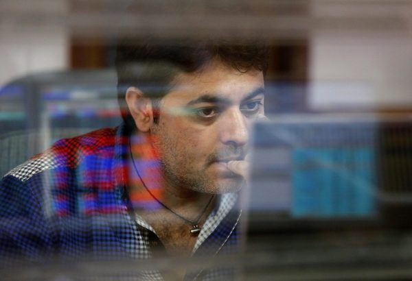 A broker at his computer terminal at a stock brokerage firm in Mumbai, India, 26 February, 2016. (Photo: Reuters/Shailesh Andrade)