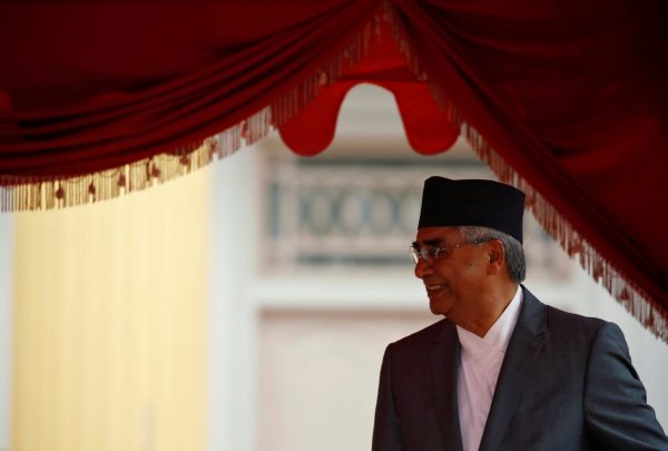 Newly elected Nepalese Prime Minister Sher Bahadur Deuba smiles as he arrives for his swearing-in ceremony at the presidential building in Kathmandu, Nepal 7 June, 2017. (Photo: Reuters/ /Navesh Chitrakar).