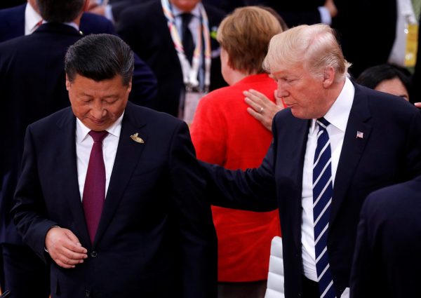 US President Donald Trump talks to China's President Xi Jinping during the G20 leaders summit in Hamburg, Germany, 7 July 2017. (Photo: Reuters/Philippe Wojazer).
