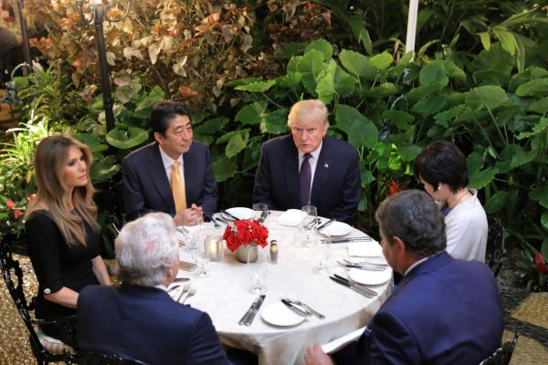 A clear-cut success for Japan’s diplomacy: Japanese Prime Minister Shinzo Abe, US President Donald Trump, their wives and guests at Mar-a-lago, Florida, in February 2017. (Photo: Reuters/Carlos Barria).