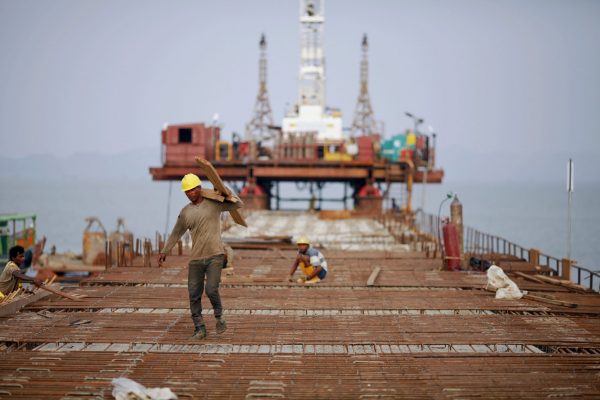 Workers from Indian conglomerate Essar Group construct a new port in Sittwe, 19 May 2012. (Photo: Reuters/Damir Sagolj).