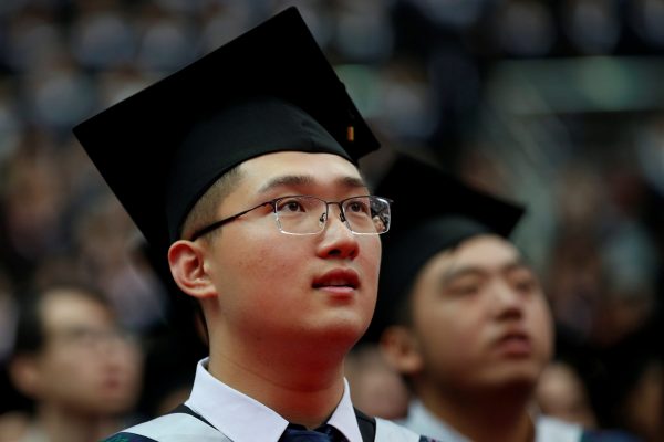 Students attend a graduation ceremony at Fudan University in Shanghai, China, 23 June, 2017 (Photo: Reuters/Aly Song).