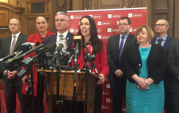 Jacinda Ardern (C), New Zealand's new opposition Labour leader, speaks to the press alongside members of her party after Andrew Little stepped down in Wellington, New Zealand, 1 August 2017. (Photo: Reuters/Charlotte Greenfield).