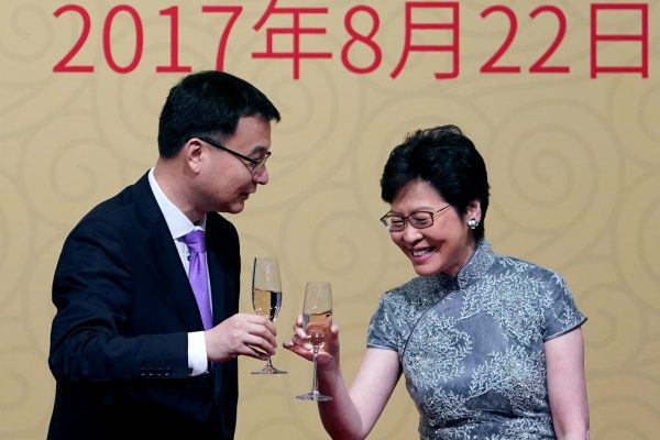 Hong Kong Chief Executive Carrie Lam (R) and vice Mayor of Shanghai Zhou Bo clink glasses at a celebration of the 20th Anniversary of the Establishment of HKSAR Gala Banquet in Shanghai, China, 12 August 2017. (Photo: Reuters/Aly Song).