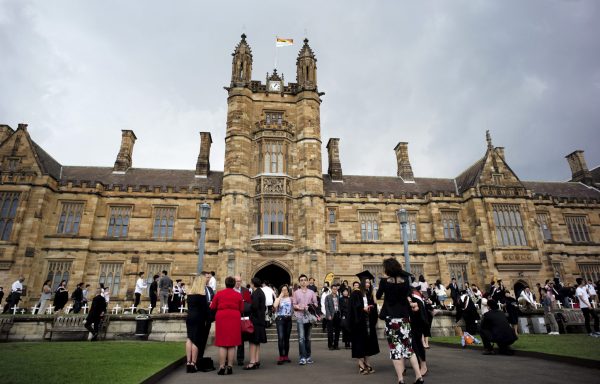 University students walk on the campus of University of Sydney following a graduation ceremony in Sydney, Australia, 22 April 2016. (Photo: Reuters/Jason Reed).