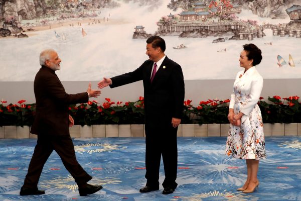 Chinese President Xi Jinping and his wife Peng Liyuan greet Indian Prime Minister Narendra Modi before the welcoming banquet for the BRICS Summit, in Xiamen, China, 4 September 2017. (Photo: Reuters/Tyrone Siu).