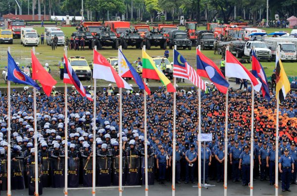 Armoured Personnel Carrier (APC) and members of the Philippine National Police (PNP) gather as they prepare for deployment for security during the send-off ceremony for the 31st Association of Southeast Asian Nations (ASEAN) Summit this month at Rizal park in Manila, Philippines, 5 November, 2017 (Photo: Reuters/Romeo Ranoco).