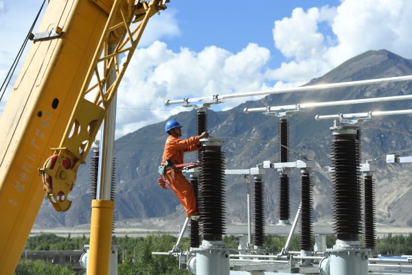 An employee from the state-owned State Grid Corporation of China works at an electric substation in Zhanang county, Tibet Autonomous Region, China, 30 August 2017 (Photo: Reuters/Stringer).