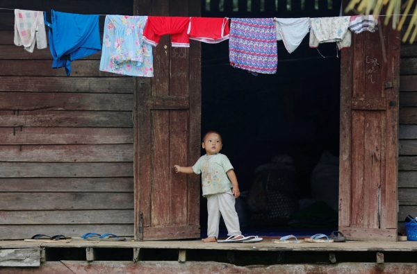 A boy displaced in the conflict between Kachin Independence Army and the Tatmadaw military for the control of an amber mine stands at a Christian church in Tanai township, Kachin State, Myanmar, 15 June 2017 (Photo: Reuters/Soe Zeya Tun).