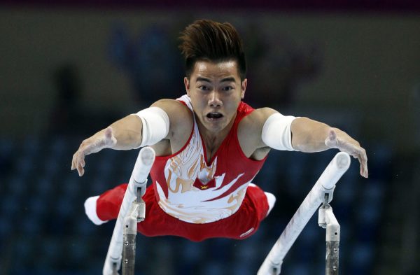 Vietnam's Pham Phuoc Hung competes in the men's parallel bars final of the artistic gymnastics competition at the Namdong Gymnasium Club during the 17th Asian Games in Incheon, 25 September 2014 (Photo: Reuters/Jason Reed).