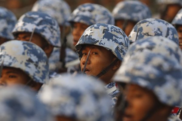 Soldiers march during a parade to mark Armed Forces Day in Myanmar's capital Naypyitaw, 27 March 2016 (Photo: Reuters/Soe Zeya Tun).